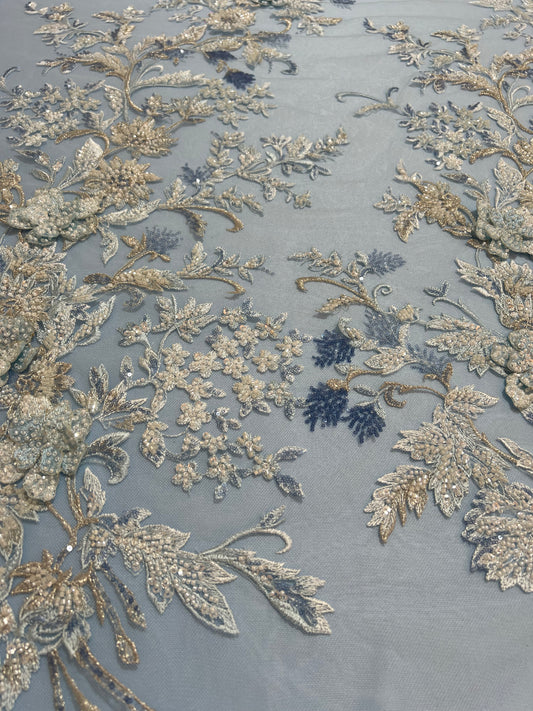 TUL BORDADO AZUL CIELO CON PEDRERIA Y FLORES DORADA